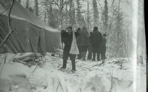 Search party near tent.
